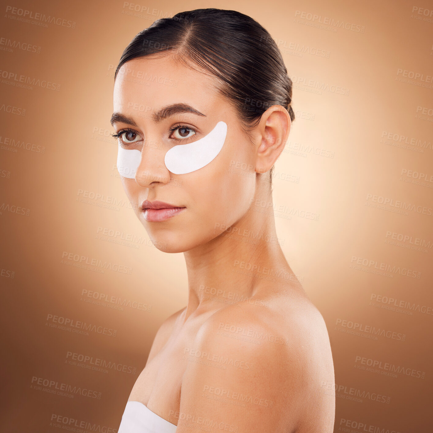 Buy stock photo Skincare, face or woman with eye patch for studio dermatology, cosmetic healthcare or beauty treatment. Spa care, facial collagen product or female model with hyaluronic acid mask on brown background