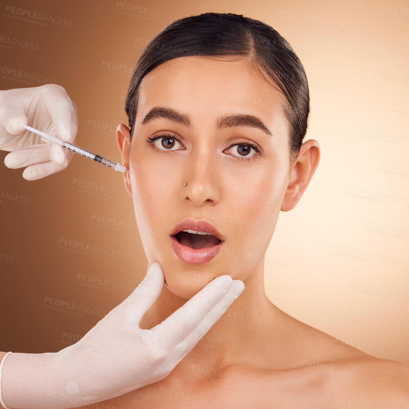 Buy stock photo Plastic surgery hands, surprise portrait and woman face with needle facial change, cosmetic process or studio skincare. Filler injection, wow healthcare or aesthetic female beauty on brown background