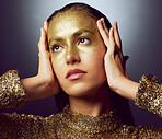Glitter, gold and makeup with woman in studio for fashion, beauty and creative art. Glamour, trendy and cosmetics with female isolated on black background for luxury, elegance and shimmer sparkles