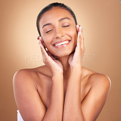 Buy stock photo Beauty, skincare and face with indian woman in studio for happy, spa treatment and facial. Cosmetics, self care and glow with model on brown background for satisfaction, natural makeup and confidence