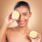 Skincare, woman portrait and lemon for health, wellness and beauty of a young model with happiness. Studio, smile and healthy fruit with vitamin c and fruits nutrition for facial and dermatology