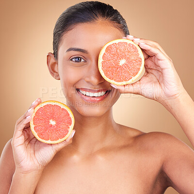 Buy stock photo Skincare, woman portrait and grapefruit for health, wellness and beauty of a young model with happiness. Studio, smile and healthy fruit with vitamin c and fruits nutrition for facial and dermatology