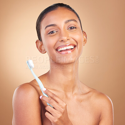 Beauty, smile and toothbrush with portrait of indian woman in studio for brushing teeth, dental and cosmetics. Oral hygiene, clean and self care with model on brown background for routine and health
