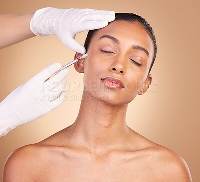 Buy stock photo Woman, face and needle with beauty and dermatology, skincare with plastic surgery on studio background. Female, hands and skin injection, cosmetic procedure with facelift treatment and eyes closed