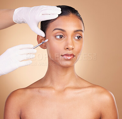 Buy stock photo Woman, face and needle with beauty and dermatology, skincare with plastic surgery on studio background. Female, hands and skin injection, cosmetic procedure with facelift treatment and eyes closed