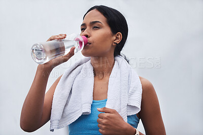 Buy stock photo Running, rest and drinking water with woman in outdoors for fitness, training and cardio endurance. Stamina, health and workout with tired female runner for jogging, exercise and performance