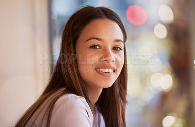 Buy stock photo Portrait, happy and a woman in a coffee shop, sitting by the window to relax alone over the weekend. Face, smile and cafe with an attractive young female customer waiting for service in a restaurant