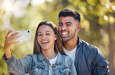 Buy stock photo Couple, outdoor and selfie with a smile for love, care and happiness together in summer. Young man and woman at nature park for a profile picture on a happy and romantic date or vacation to relax