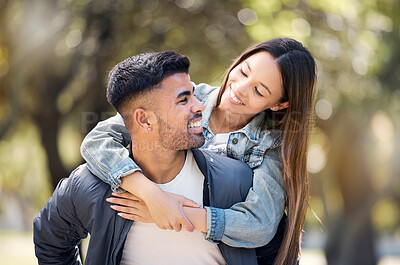 Buy stock photo Couple, smile and outdoor on piggyback for love, care and happiness together in summer. Young man and woman at nature park for a moment on a happy and romantic date or vacation to relax