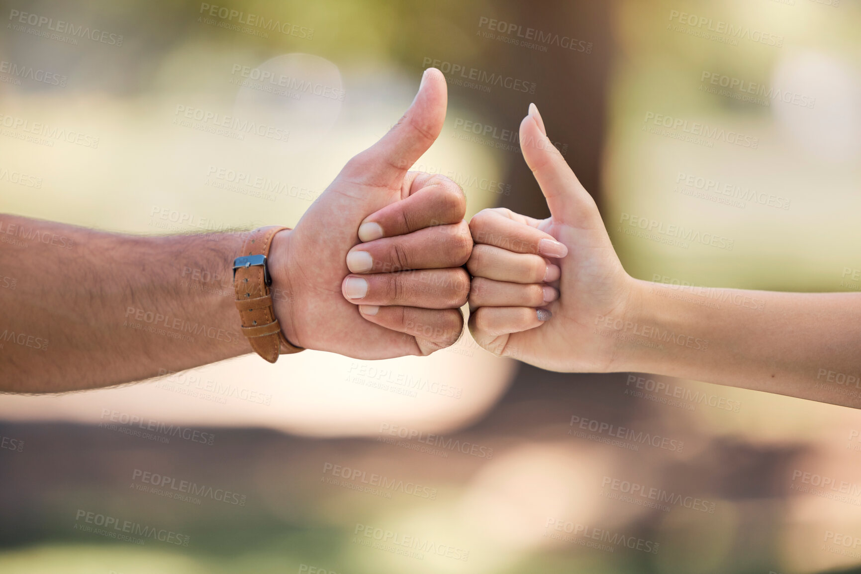 Buy stock photo Thumbs up, fist bump and people with outdoor teamwork, support and collaboration mission or agreement. Man, woman partner or couple of friends with like, deal and success hands sign, power and park
