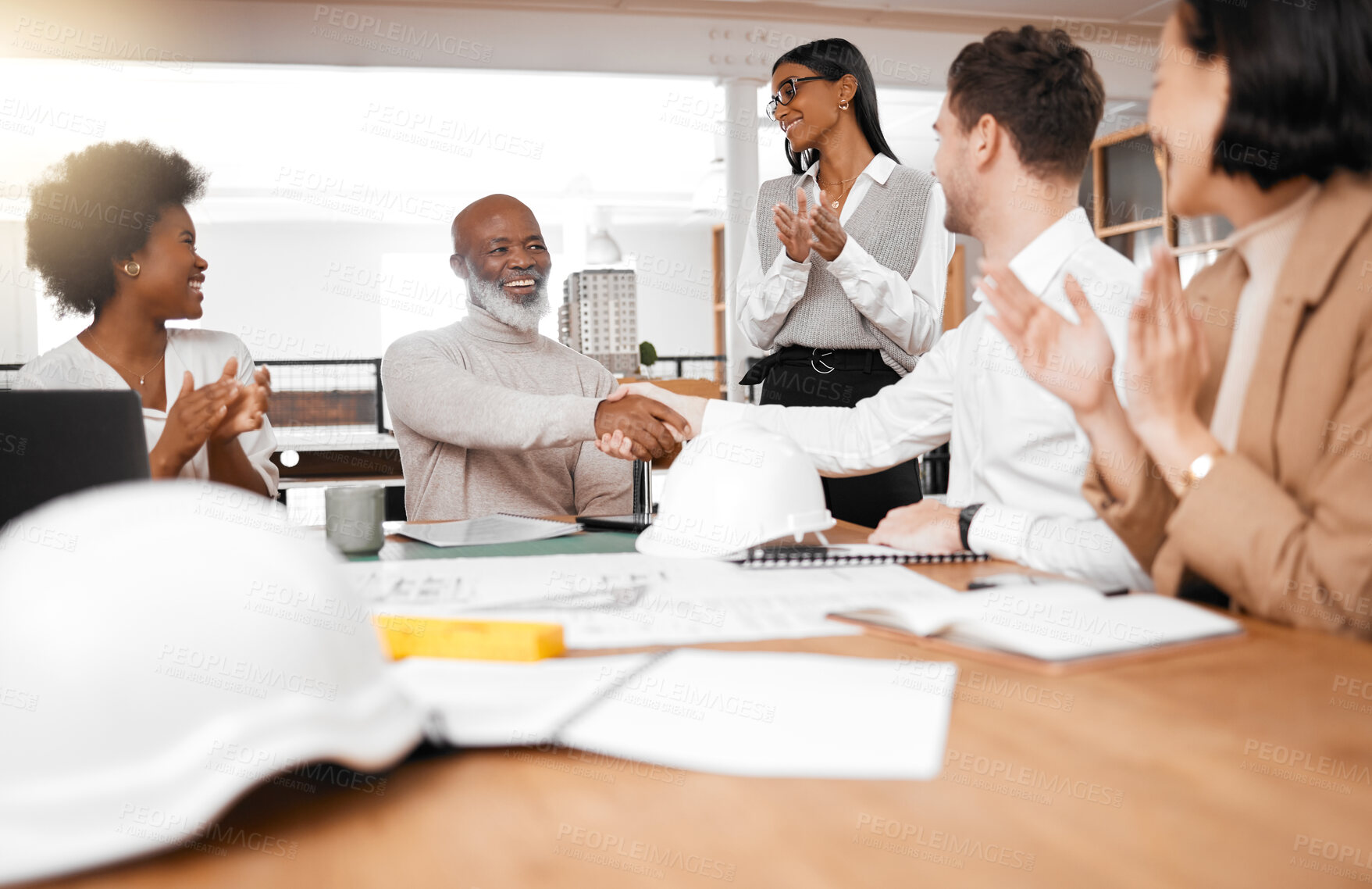 Buy stock photo Handshake, meeting and team of engineering people clapping, celebration and partnership success, goals or onboarding. Architecture employees shake hands for design project, contract or job thank you