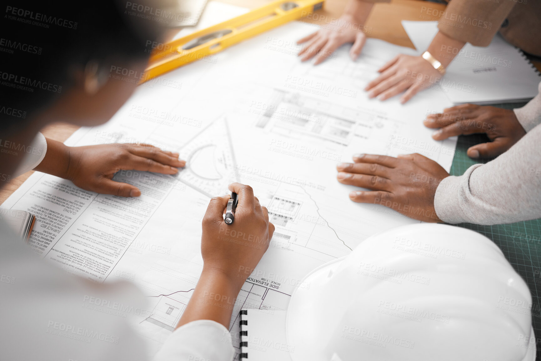 Buy stock photo Hands, collaboration and architecture with a building team working in their office on design from above. Teamwork, construction or blueprint with an architect, designer and engineer at work together