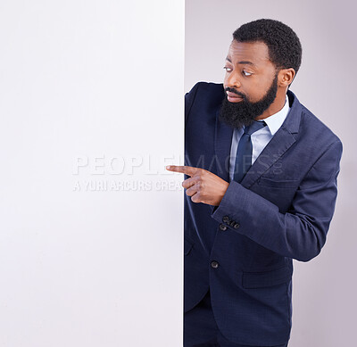 Buy stock photo Business, black man and pointing to board in white background, studio or mockup information space. Corporate worker, model and advertising poster, marketing news sign or brand on blank mock up banner