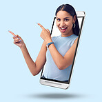 Woman, phone and screen on mockup pointing for product placement against studio background. Portrait of happy female showing finger gesture or point for marketing or advertising on smartphone display