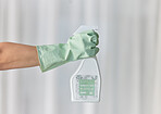 Hands, gloves and housekeeping with detergent spray bottle for spring cleaning, disinfection or dirt removal at home. Hand of cleaner holding sanitizer and rubber glove for clean hygiene or disinfect