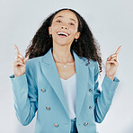 Business woman, portrait smile and pointing on mockup for advertising or marketing against a white studio background. Happy isolated female model with finger gesture or point for product placement