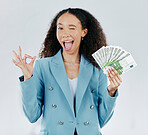 Portrait, wink and cash with a business woman in studio on a gray background making a perfect hand gesture. Funny face, finance and money with a female employee holding euro bills for investment