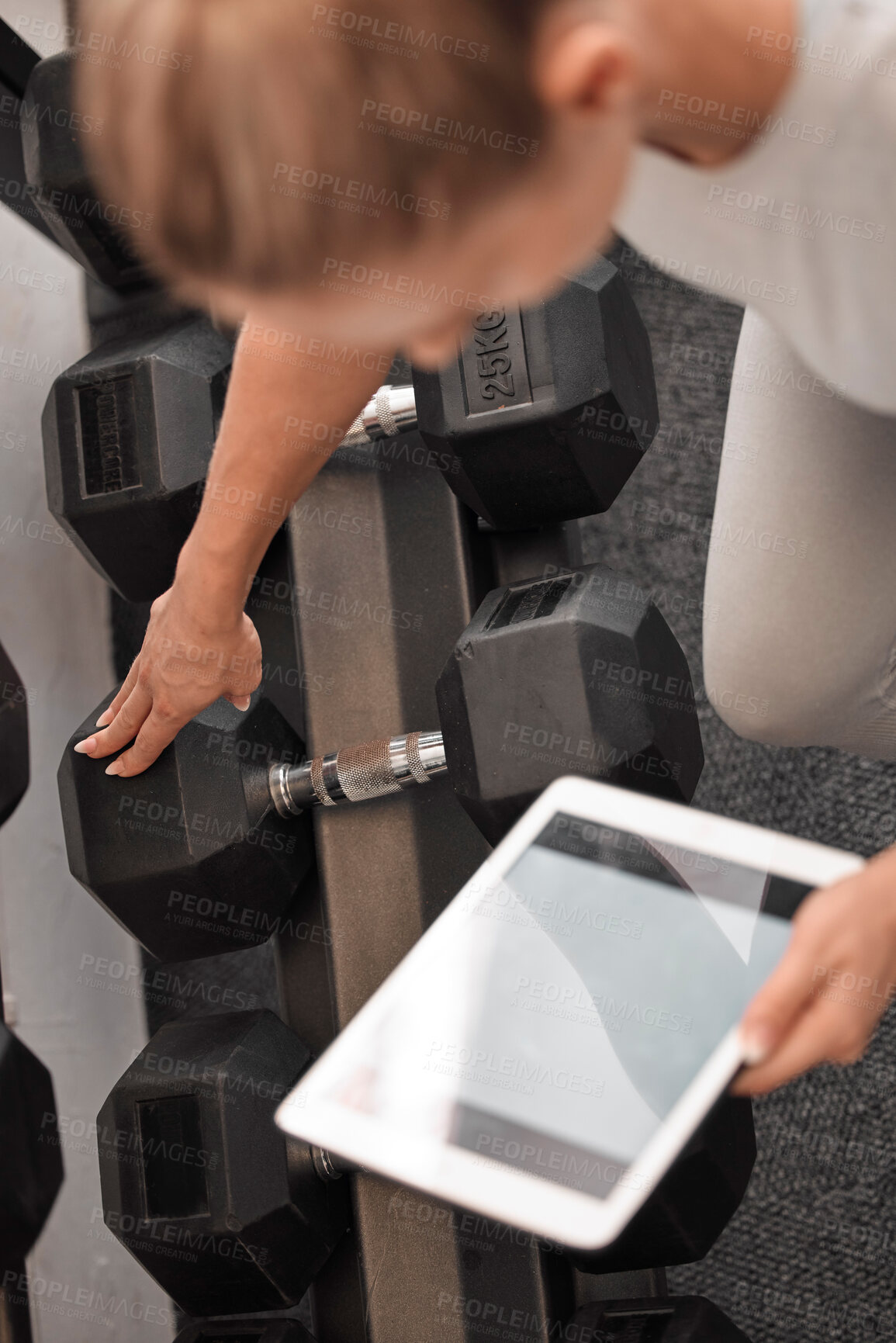 Buy stock photo Fitness, woman and tablet mockup for weightlifting tutorial, exercise or schedule workout and planning at the gym. Hands of active female with touchscreen display for online training with dumbbells