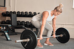 Fitness, weightlifting and a woman bodybuilder in the gym for a workout to build a strong muscular physique. Exercise, bodybuilding and a female weightlifter training her body in a wellness center