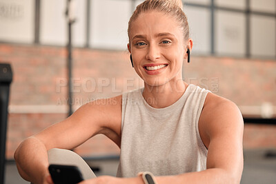 Buy stock photo Happy woman, portrait and earphones in gym with smartphone for radio, sports podcast and training. Female, fitness and listening to music with mobile app, happiness and social media in health club