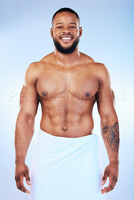 Buy stock photo African man, shower and towel in studio portrait with smile, wellness and start to morning by blue background. Young guy, cleaning body and skincare for happiness, health and self care by backdrop