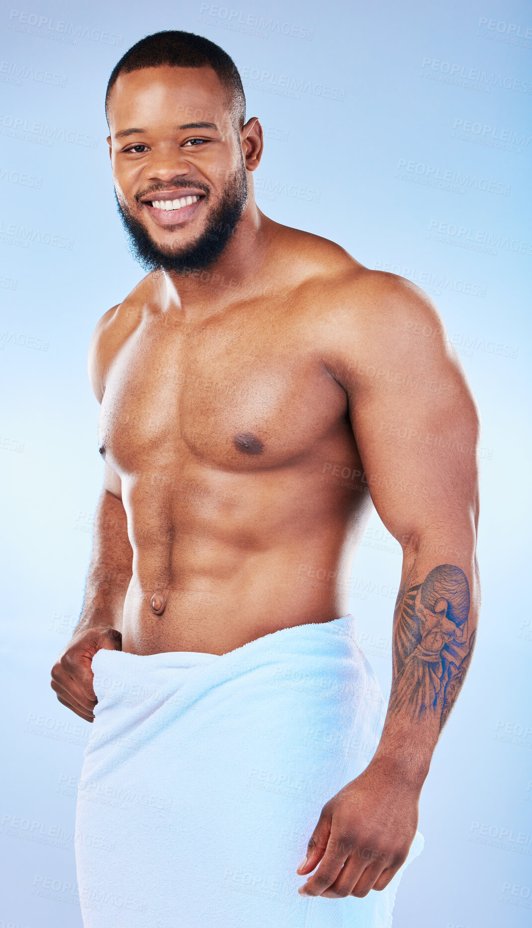 Buy stock photo Black man, bodybuilder and towel in studio portrait with smile, wellness or start to morning by blue background. Youth african guy, body and skincare with happiness, health and self care by backdrop