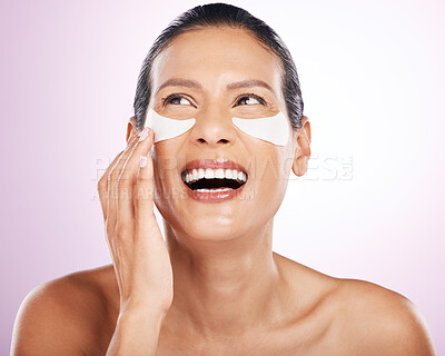 Laughing, skincare and woman eye patches in studio isolated on purple background. Thinking, dermatology cosmetics or funny, face and mature female model with facial mask for healthy skin or collagen.
