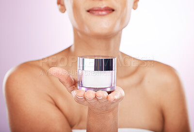 Buy stock photo Hands, cream jar and skincare of woman in studio isolated on a purple background. Face, dermatology cosmetics and female model holding lotion container, creme or moisturizer product for skin health.