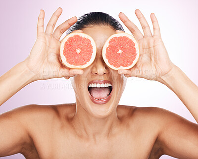 Buy stock photo Face laughing, grapefruit and skincare of woman in studio isolated on a purple background. Natural cosmetics, food and happy mature female model with fruit for vitamin c, nutrition and healthy diet.