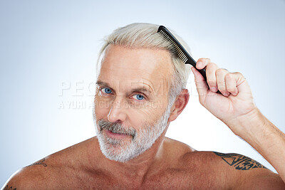 Buy stock photo Hair style, comb and portrait of man in studio for haircare, barber and morning routine. Beauty, hairdresser and salon with senior male on white background for handsome, self care and brushing 