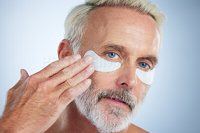 Buy stock photo Beauty, mask for eyes and portrait of old man in studio for wellness, facial treatment and anti aging cosmetics. Skincare, dermatology and face of male with pads for wrinkles, grooming and health