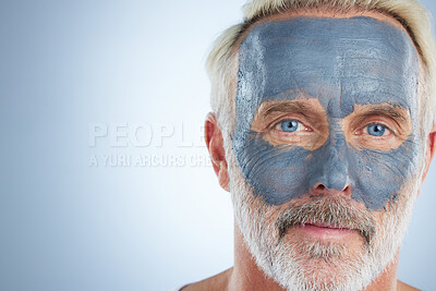 Buy stock photo Face mask, skincare and facial with man in studio and mockup for cleansing, detox and spa. Cosmetics, treatment and dermatology with senior model on gray background for anti aging, product or natural