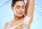 Water splash, beauty and woman with razor for shaving armpit with foam, cleaning products and cosmetics. Skincare, hair removal and girl with shaver for body hygiene, grooming and wellness in studio