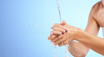 Buy stock photo Water, girl or washing hands in studio on blue background for wellness or skincare hydration. Healthcare mockup, body care zoom or woman cleaning with liquid splash for hygiene or bacteria prevention