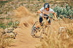 Extreme sports, cycling and man on bicycle in the countryside for fitness, stunt and freedom. Nature, biking and sporty male cyclist training, practice and speed, action and free on Mexico dirt road