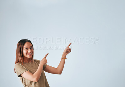 Buy stock photo Woman, pointing hands and smile at space for mockup, studio advertising or product placement. Happy female on white background to show logo or branding with discount, promotion or sale announcement