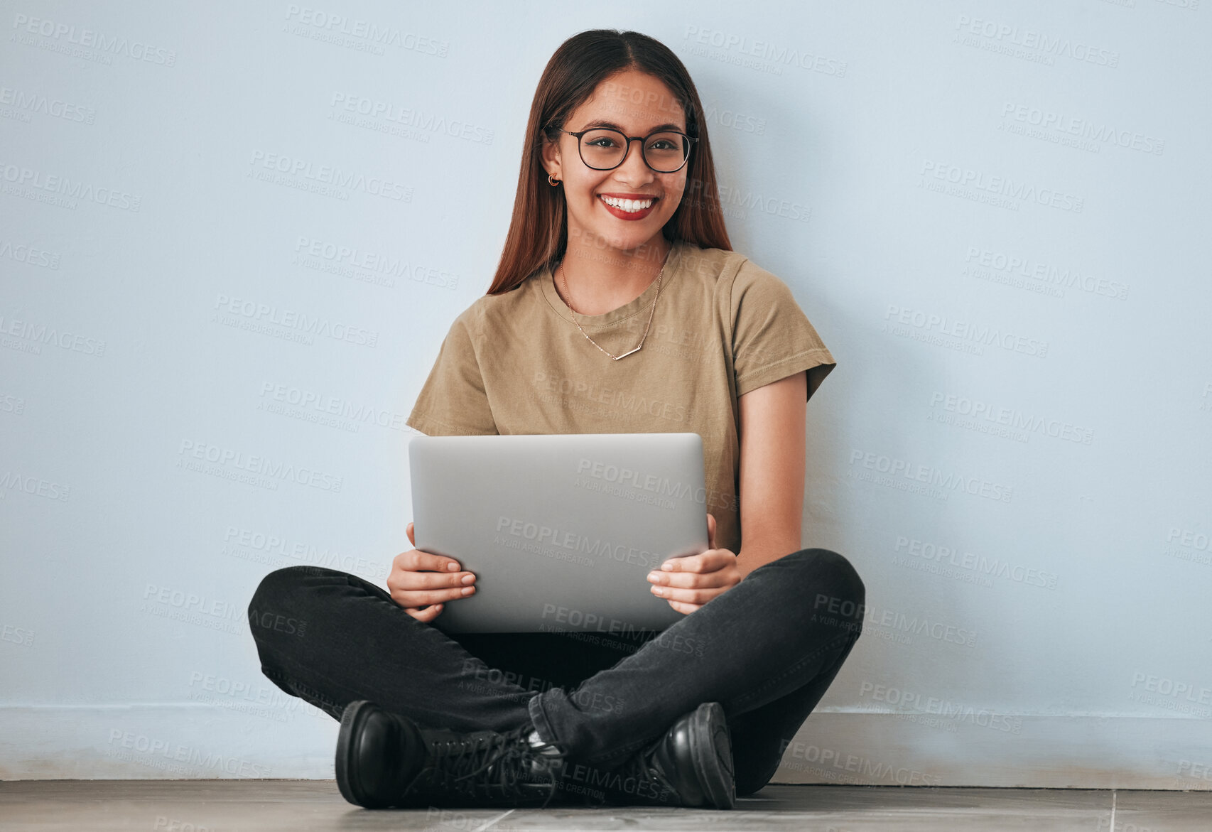 Buy stock photo Portrait, smile and student woman with laptop in home for studying, learning or education. Technology, computer and happy female sitting on floor with pc for research on wall background for mockup.