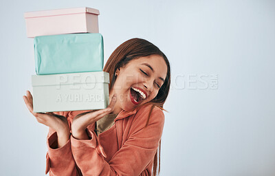 Gift box, excited and studio woman with shopping sales product, discount fashion deal or mall store present. Commerce market, retail person and happy customer celebrate on mockup grey background