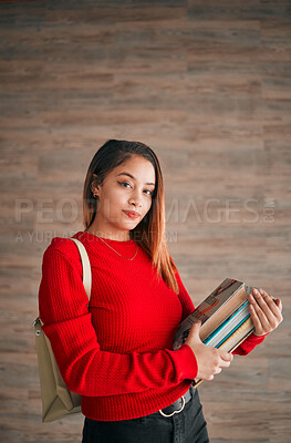 Buy stock photo Serious, books and education with portrait of woman on wall background for learning, college and scholarship. University, knowledge and academic with female student for school, intelligent and campus