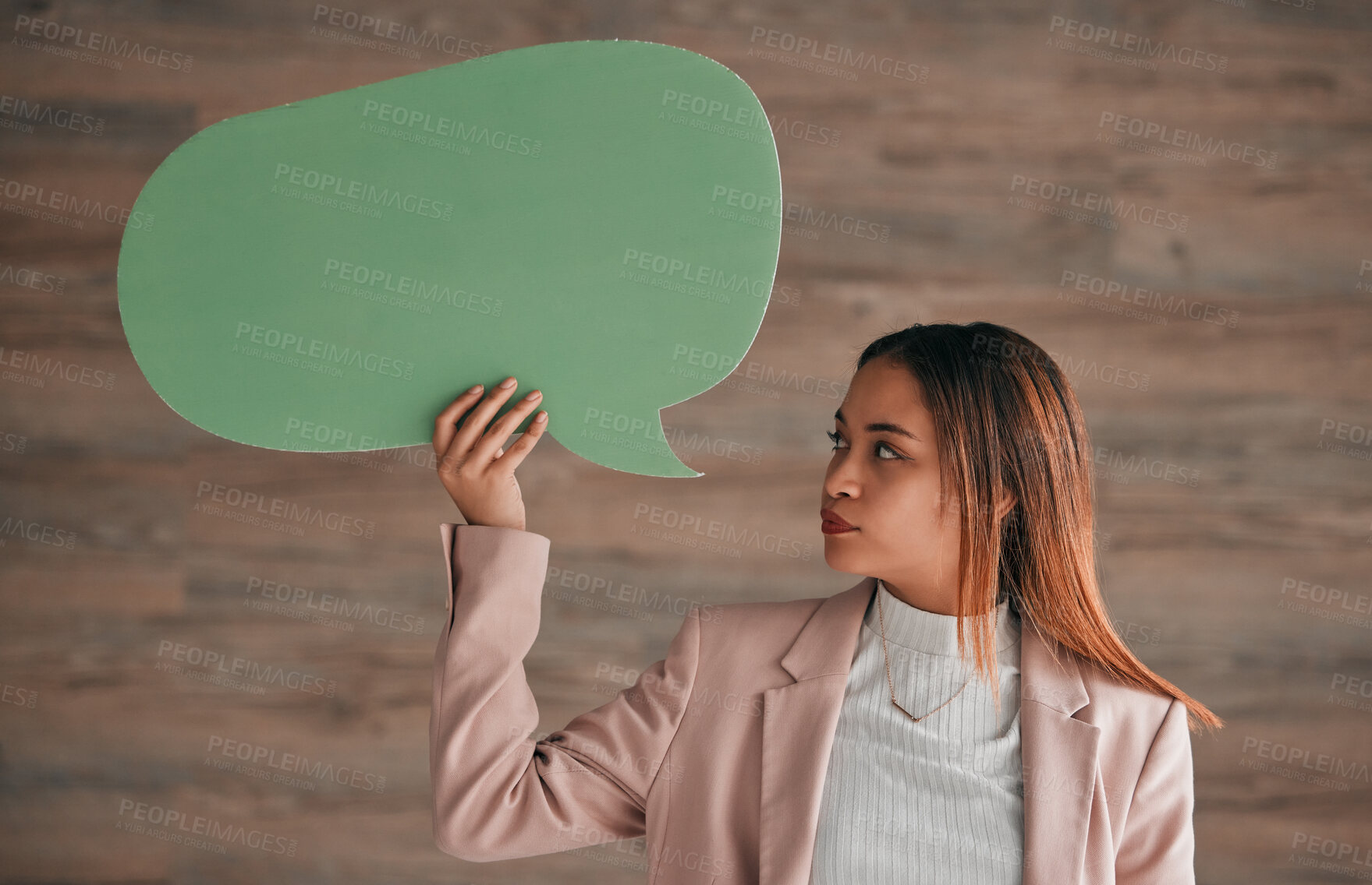 Buy stock photo Business woman, speech bubble and wall background, blank sign for social media chat or notification. Professional person holding empty sign for announcement, info or opinion on ideas for startup chat