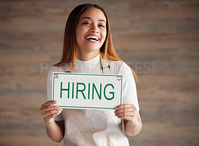 Buy stock photo Woman, portrait and hiring sign for small business recruitment, career or job opportunity against a studio background. Happy female entrepreneur with apron holding billboard poster for hire on mockup