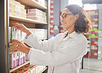 Pharmacy, woman and employee check inventory, health products and drug information. Medical professional, pharmacist and lady with pills, medicine and prescription items with stock and wellness