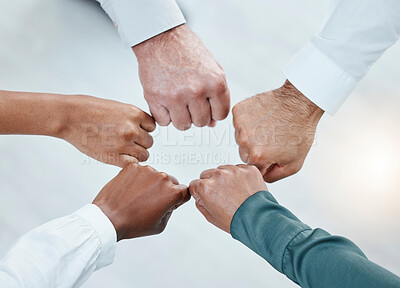 Buy stock photo Teamwork, fist bump and hands of business people together for motivation, support and community. Collaboration, team building and top view of employees in circle for diversity, solidarity and goals
