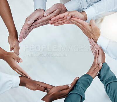Buy stock photo Teamwork, collaboration and hands of business people in circle for motivation, support and community in office. Diversity, success and top view of men and women palms for goals, trust and solidarity