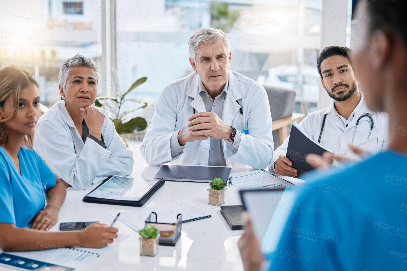 Buy stock photo Presentation, teamwork and doctors in meeting with documents for medical strategy, planning and consulting. Healthcare, collaboration and leader with people in discussion, talking and conference