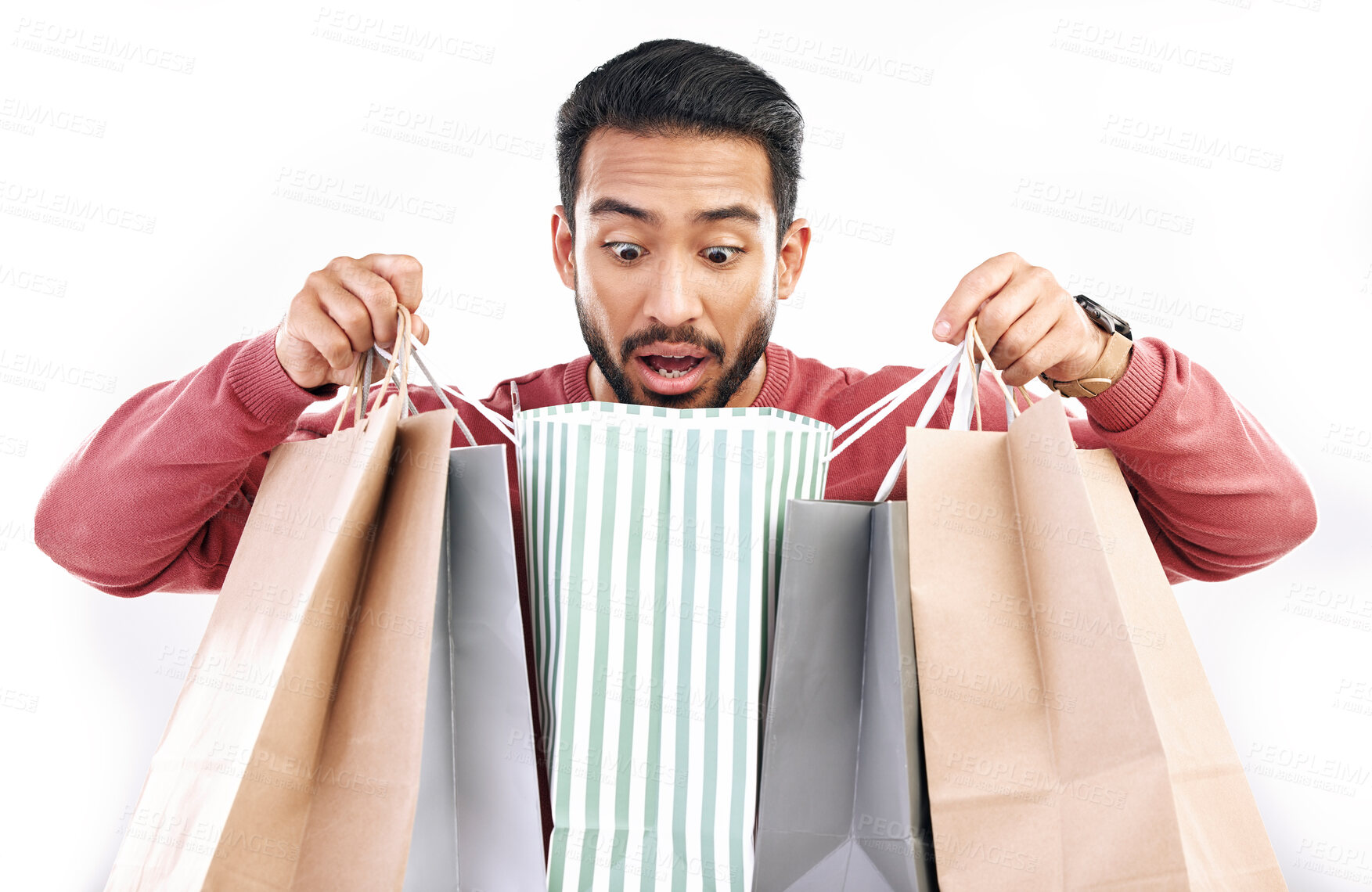 Buy stock photo Sale, wow and shocked man with shopping bag in studio, excited for discount or purchase on white background. Deal, omg and indian guy with product from shop, mall or market while posing isolated