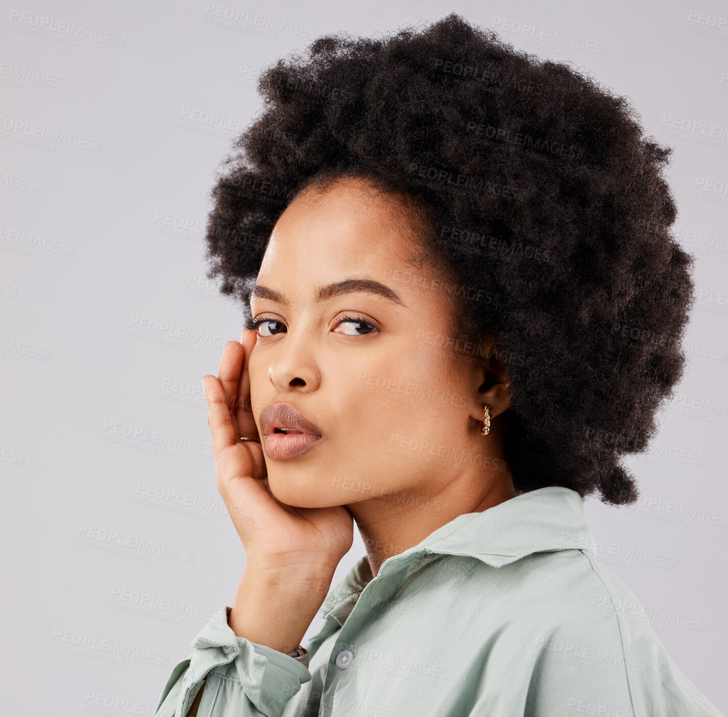 Buy stock photo Beautiful, serious and portrait of a black woman with an afro isolated on a white background in a studio. Skincare, calm and face of an African girl with a glow, looking confident and relaxed