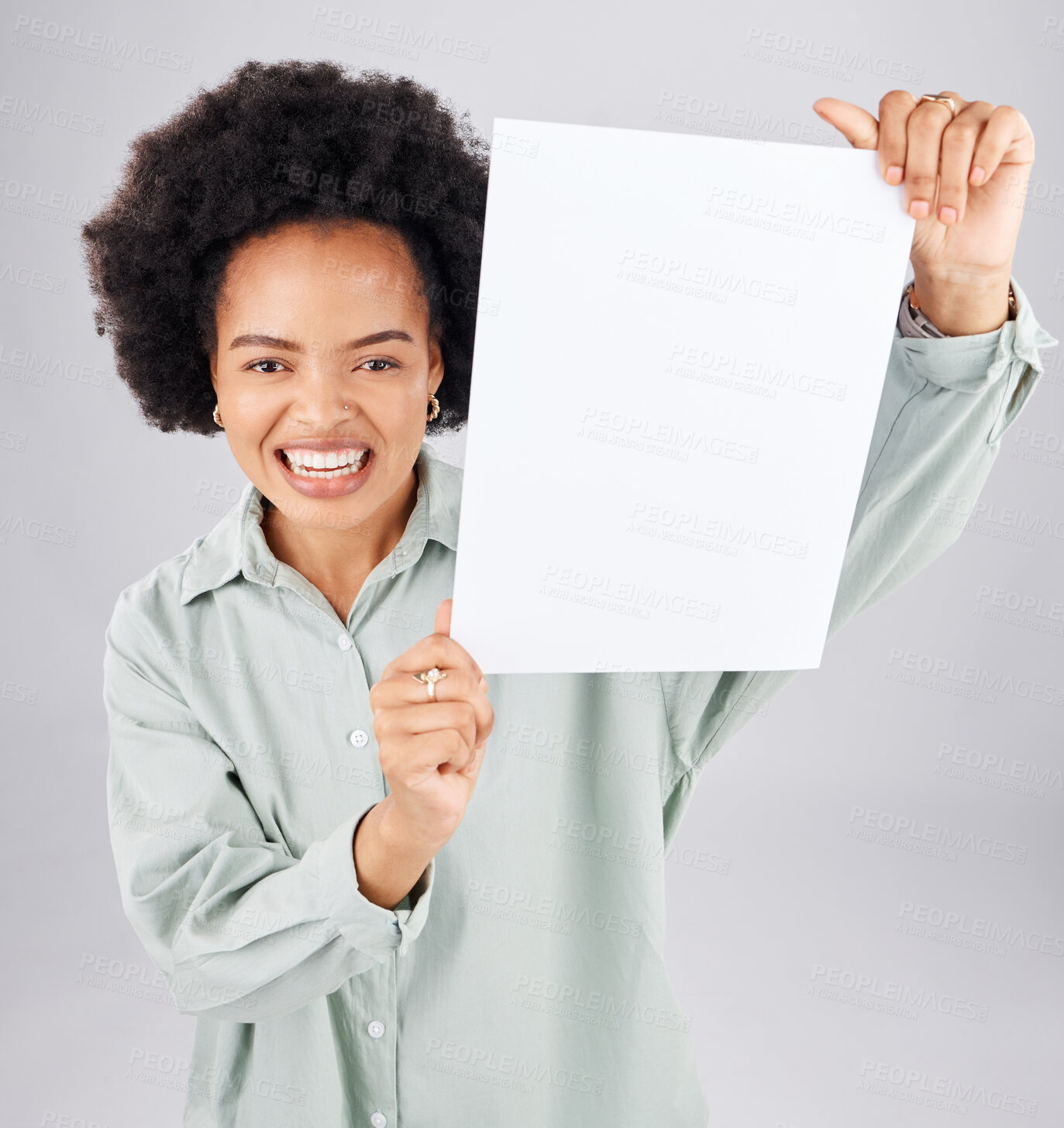 Buy stock photo Portrait, poster and mockup with a woman holding blank paper in studio on a gray background for branding. Marketing, smile or product placement with a happy young afro female showing advertising copy