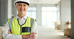 Senior woman, architect and smile with arms crossed in success for industrial architecture or construction site. Portrait of confident elderly female engineer or building contractor smiling at work