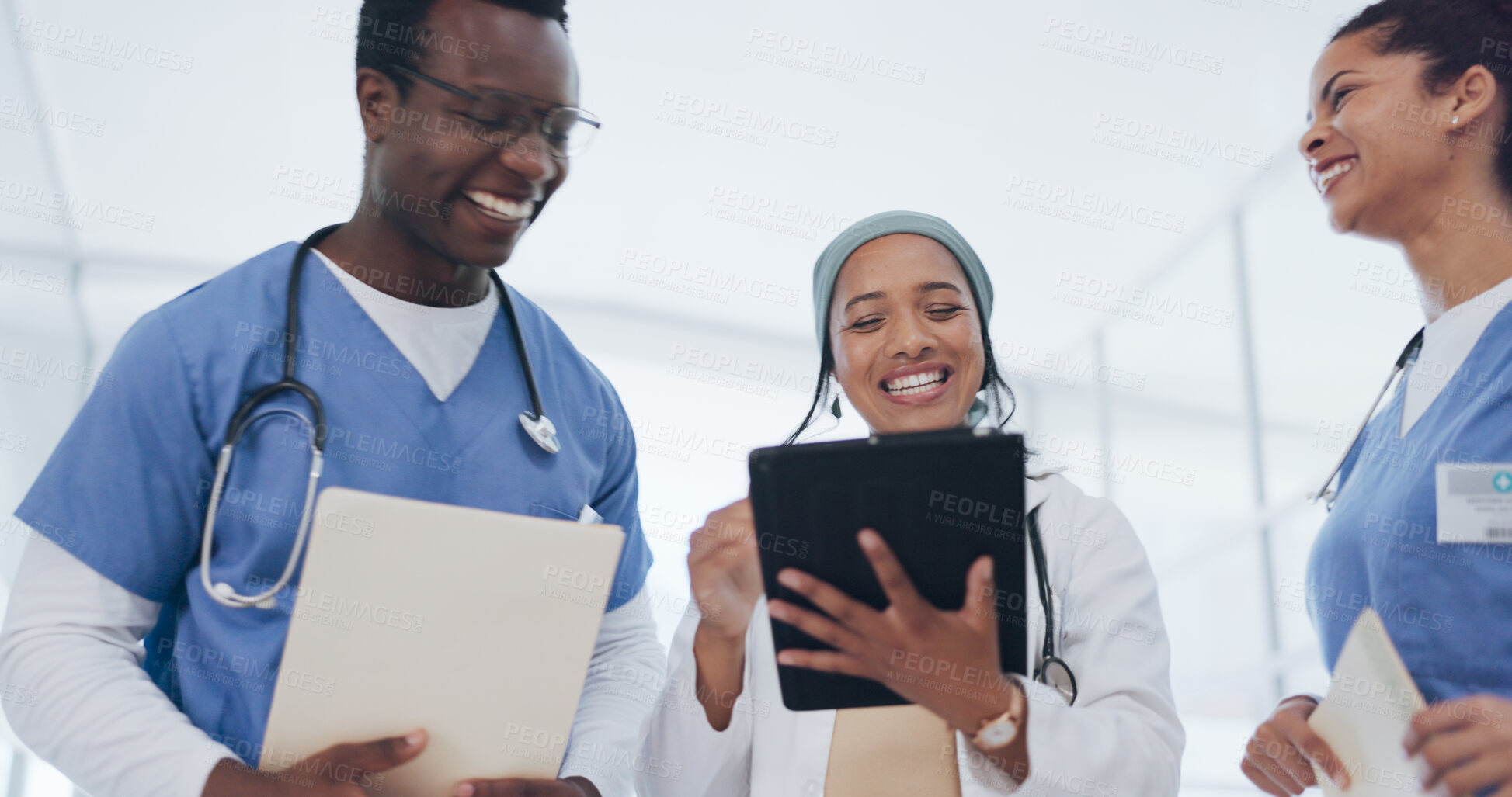 Buy stock photo Happy doctor, nurse and teamwork with tablet in meeting for consulting, planning or social media at hospital. Friendly or technology group of medical or healthcare professionals laughing together